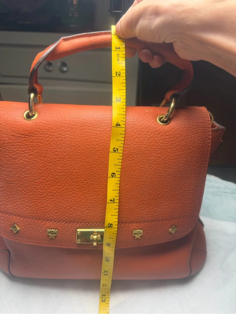 Structured Orange Leather Satchel with Top Handle and Crossbody Strap